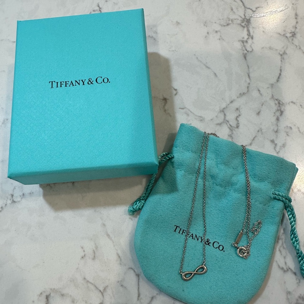 Tiffany & Co. Silver Infinity Pendant with Blue Pouch
